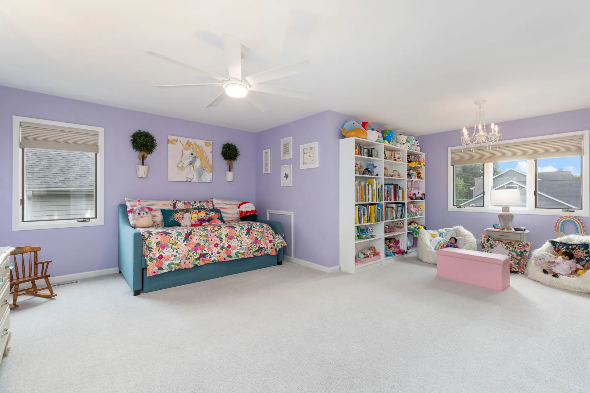 Lavender girls bedroom with daybed and built-in bookshelves